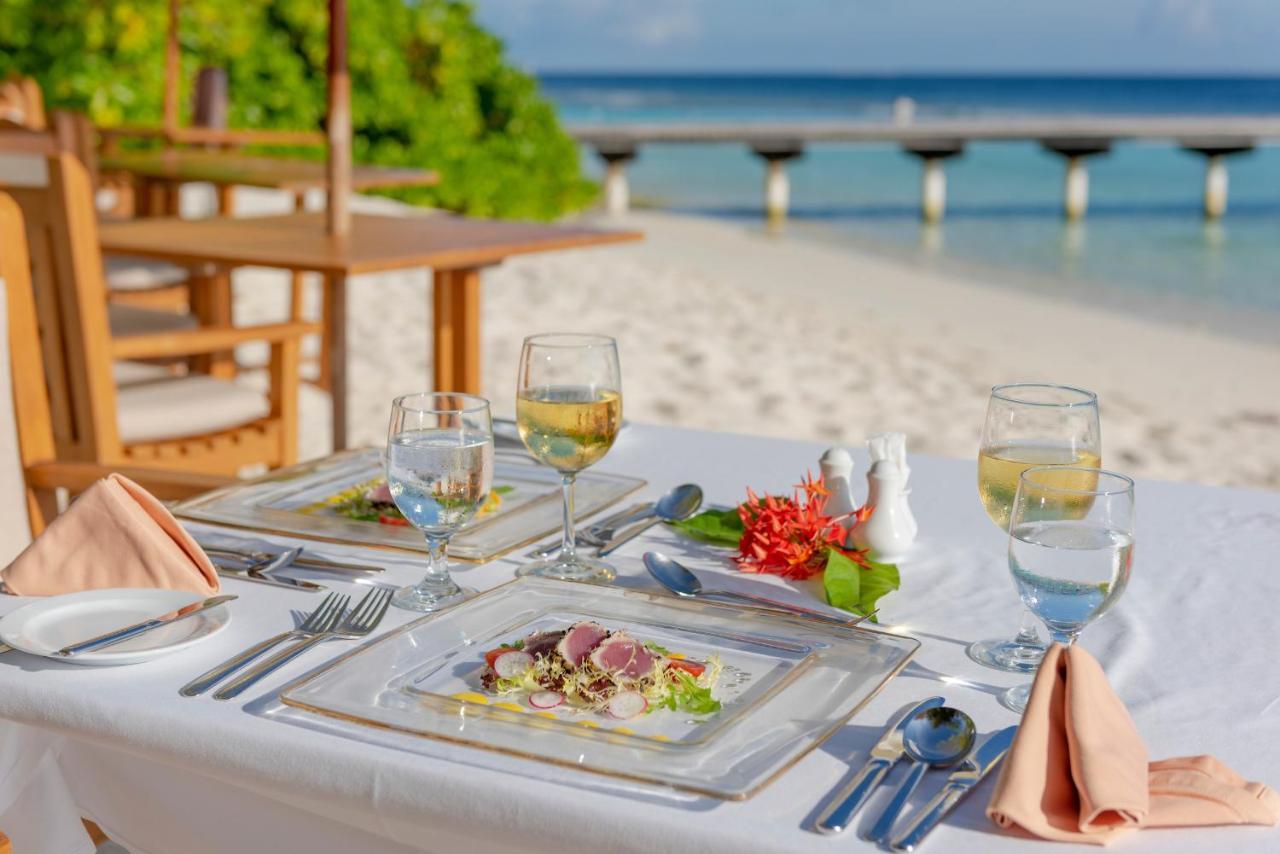 Royal Island Resort Maldives Dharavandhoo Exterior photo A table set for fine dining
